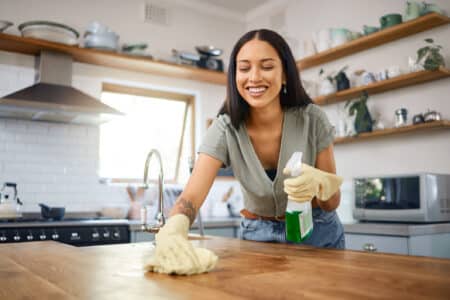 woman cleaning kitchen counters