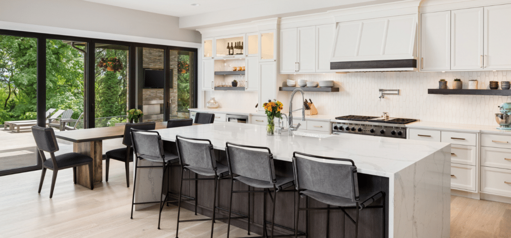 Bright kitchen with polished countertops and cabinets after professional deep cleaning.