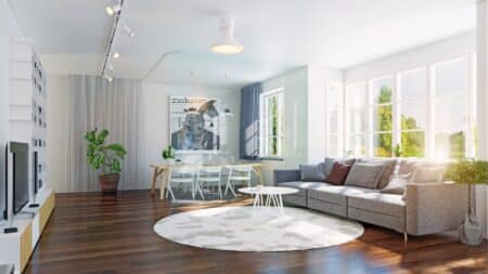 Residential cleaning team maintaining a spotless living room with polished floors.
