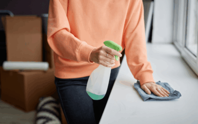 Homeowner wiping down a surface with cleaner promoting everyday cleanliness.