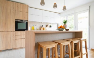 House cleaning professionals servicing a bright kitchen in neighborhoods.